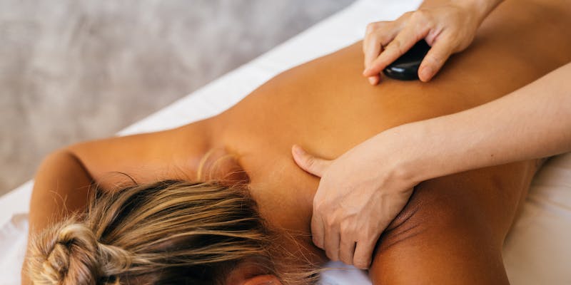 What happens during a hot stone massage?
